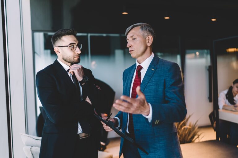 businessmen-discussing-business-strategy-in-office-2024-01-25-16-48-59-utc